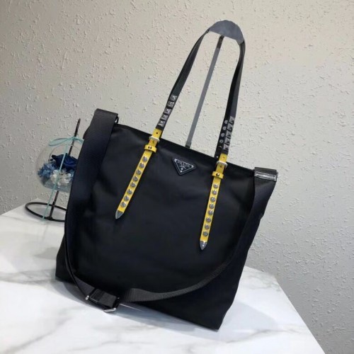 Borsa tote Prada in pelle Saffiano e nylon 1BG212 nera e gialla
